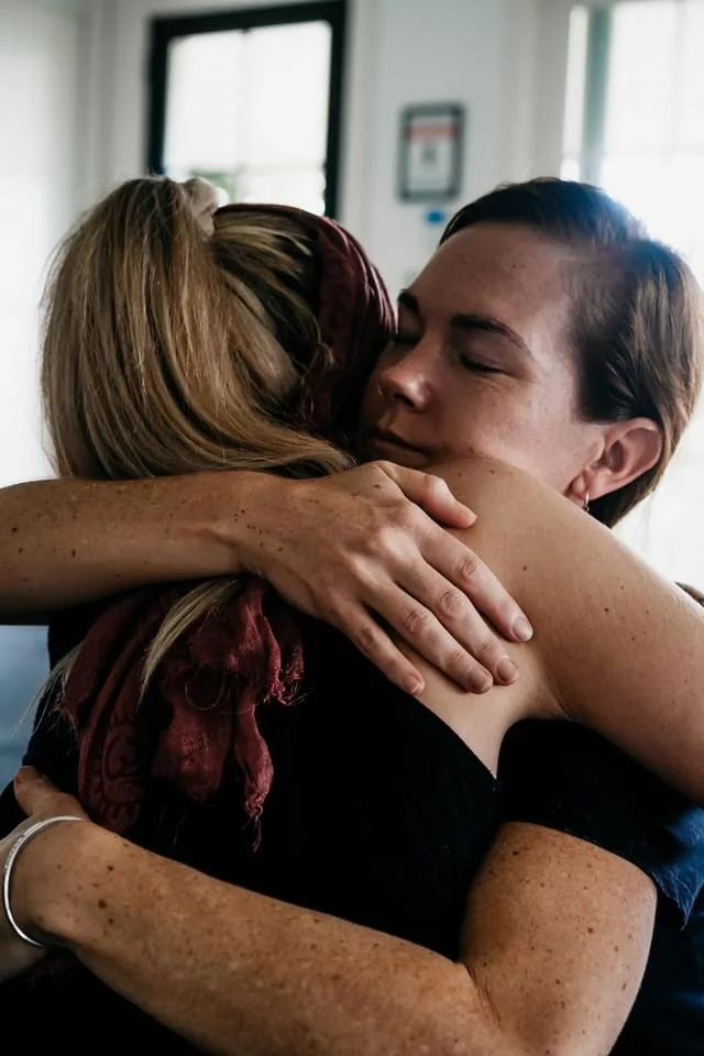 A couple in a tender embrace inside the temple space